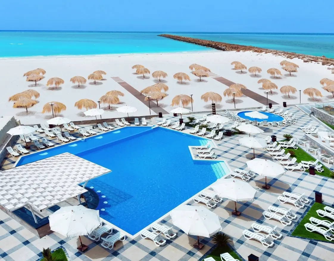 Hotelux La Paya El Alamein luxury outdoor pool and beach loungers